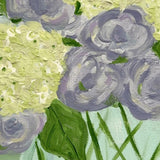 Purple and White Flowers in Blue Glass Vase